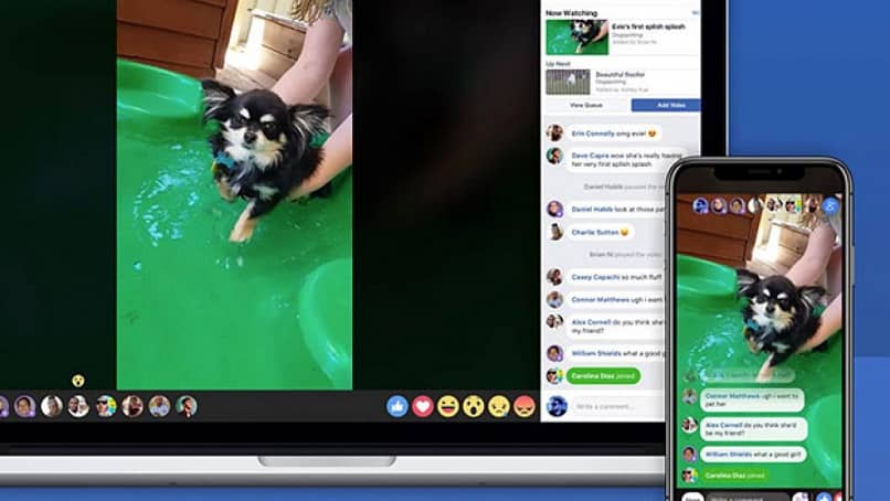 ekrany laptopów i telefonów komórkowych z filmem na Facebooku